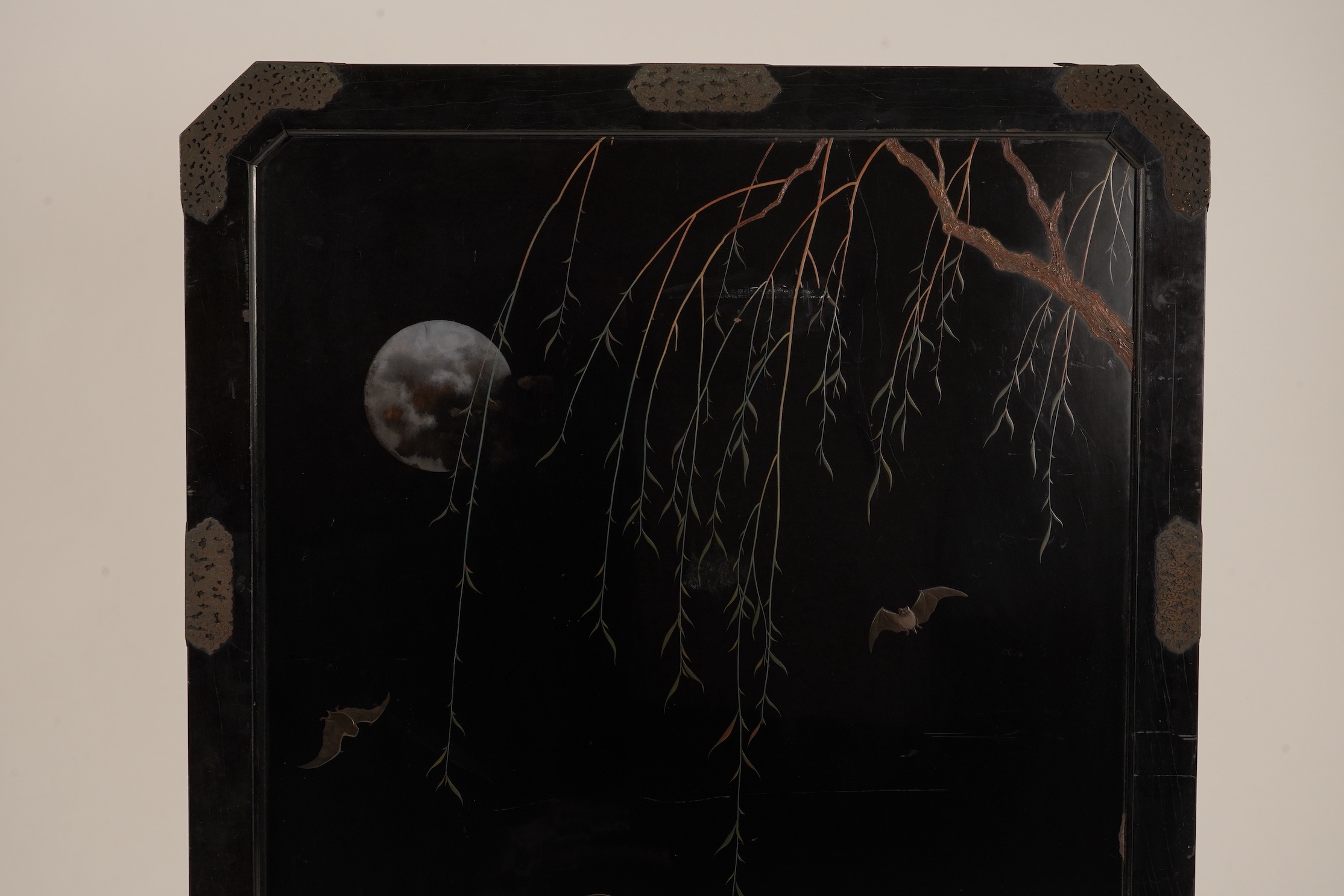 A Japanese inlaid persimmon wood tsuitate screen panel, Meiji period, possibly Tokyo School